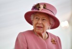 Britain's Queen Elizabeth II speaks with staff during a visit to the Defence Science and Technology Laboratory (Dstl) at Porton Down science park near Salisbury, southern England, on October 15, 2020. - The Queen and the Duke of Cambridge visited the Defence Science and Technology Laboratory (Dstl) where they were to view displays of weaponry and tactics used in counter intelligence, a demonstration of a Forensic Explosives Investigation and meet staff who were involved in the Salisbury Novichok incident. Her Majesty and His Royal Highness also formally opened the new Energetics Analysis Centre.