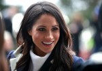 Meghan Markle meets local school children during a walkabout with Britain's Prince Harry during a visit to Birmingham