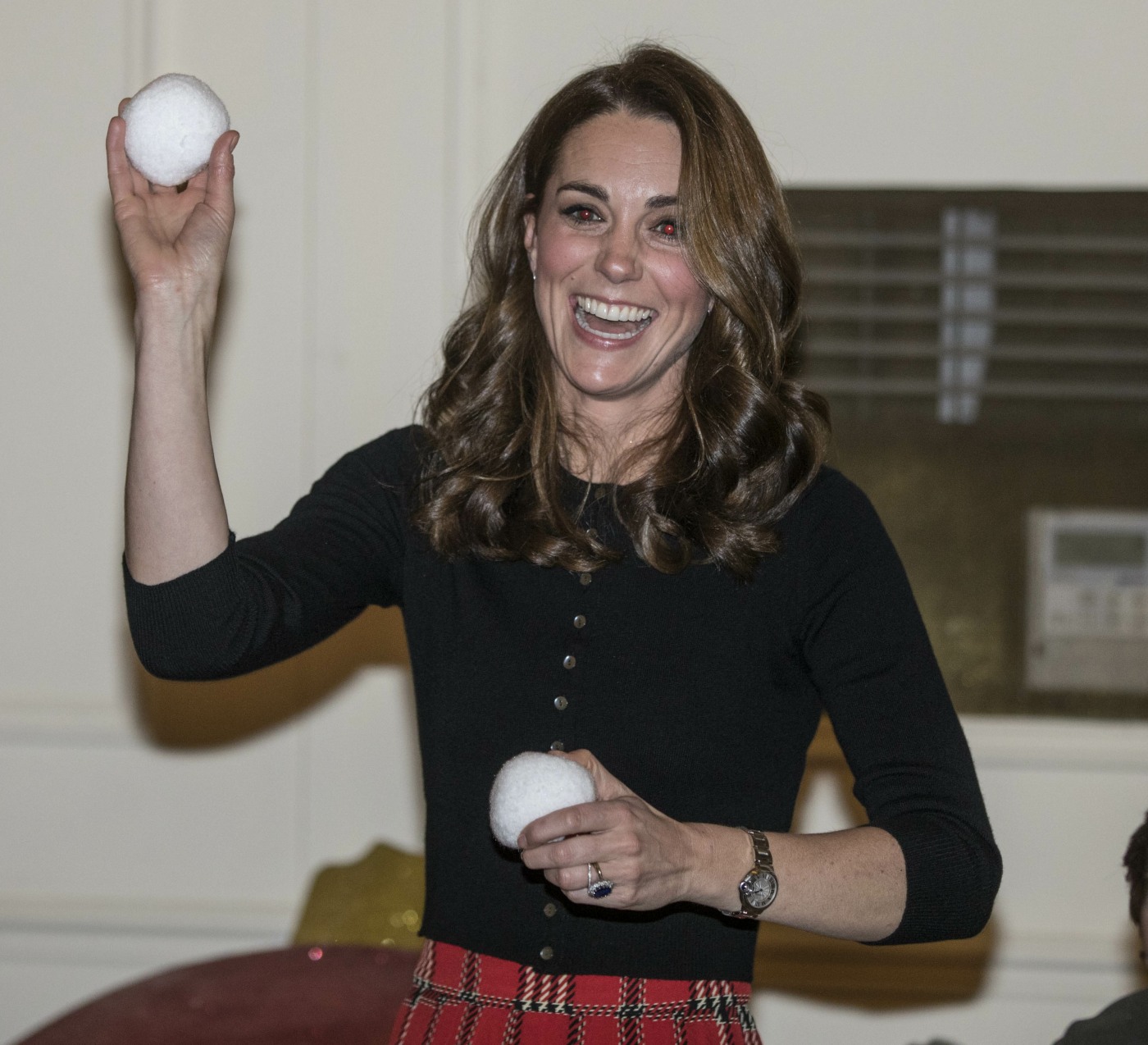 The Duchess of Cambridge throws a mock snowball as she takes part in a children's pretend snow ball fight during a Christmas party held at Kensington palace for families and children of deployed personnel from RAF Coningsby and RAF Marham serving in Cyprus. The Duke is Honorary Air Commandant of RAF Coningsby, Lincolnshire, which is home to Typhoon Sqns, who currently deploy to Cyprus in support of Op SHADER. RAF Marham have 31 Squadron, who are also contributing to OP SHADER. The event is being supported by The Royal British Legion in recognition of the unique contribution and sacrifices Serving personnel and their families make year round, and especially when they are separated during the festive period. The support of their families and loved ones is vital not only when personnel are serving, but through transition, recovery and civilian life after service, and The Royal British Legion ensures that those family members are supported in return.