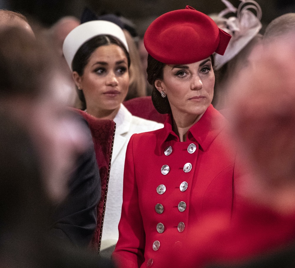 The Duchess of Cambridge sits near the Duchess of Sussex as they attend the West