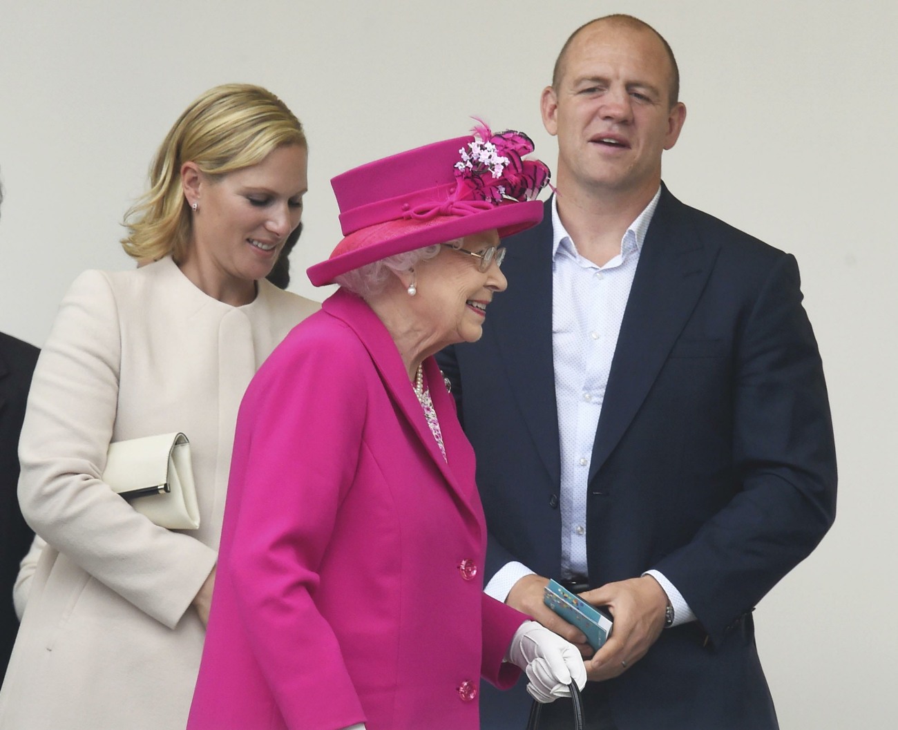 Zara and Mike Tindall leave with Britain's Queen Elizabeth after they attended the Patron's Lunch on the Mall, an event to mark the queen's 90th birthday, in London