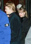 Taylor Swift stays close to her beau as she makes a rare appearance with Joe Alwyn