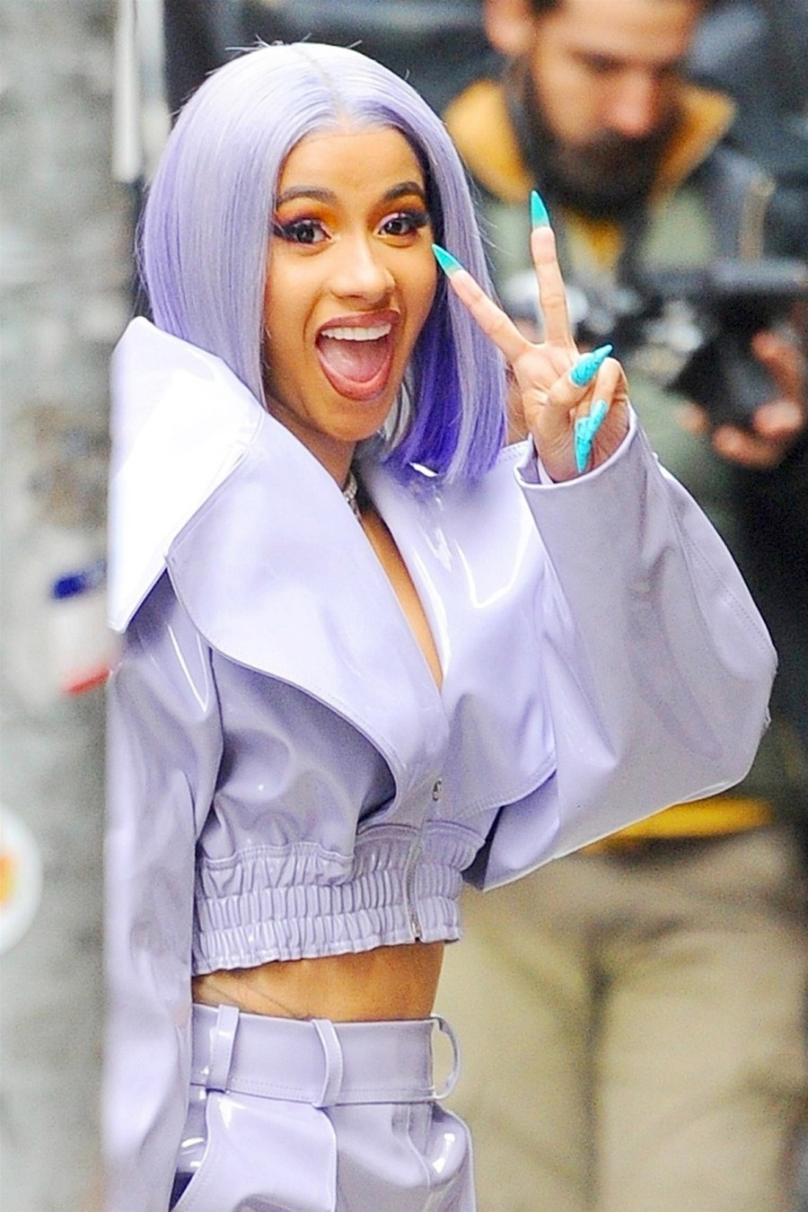 Cardi B heads out to run errands in a wild purple outfit