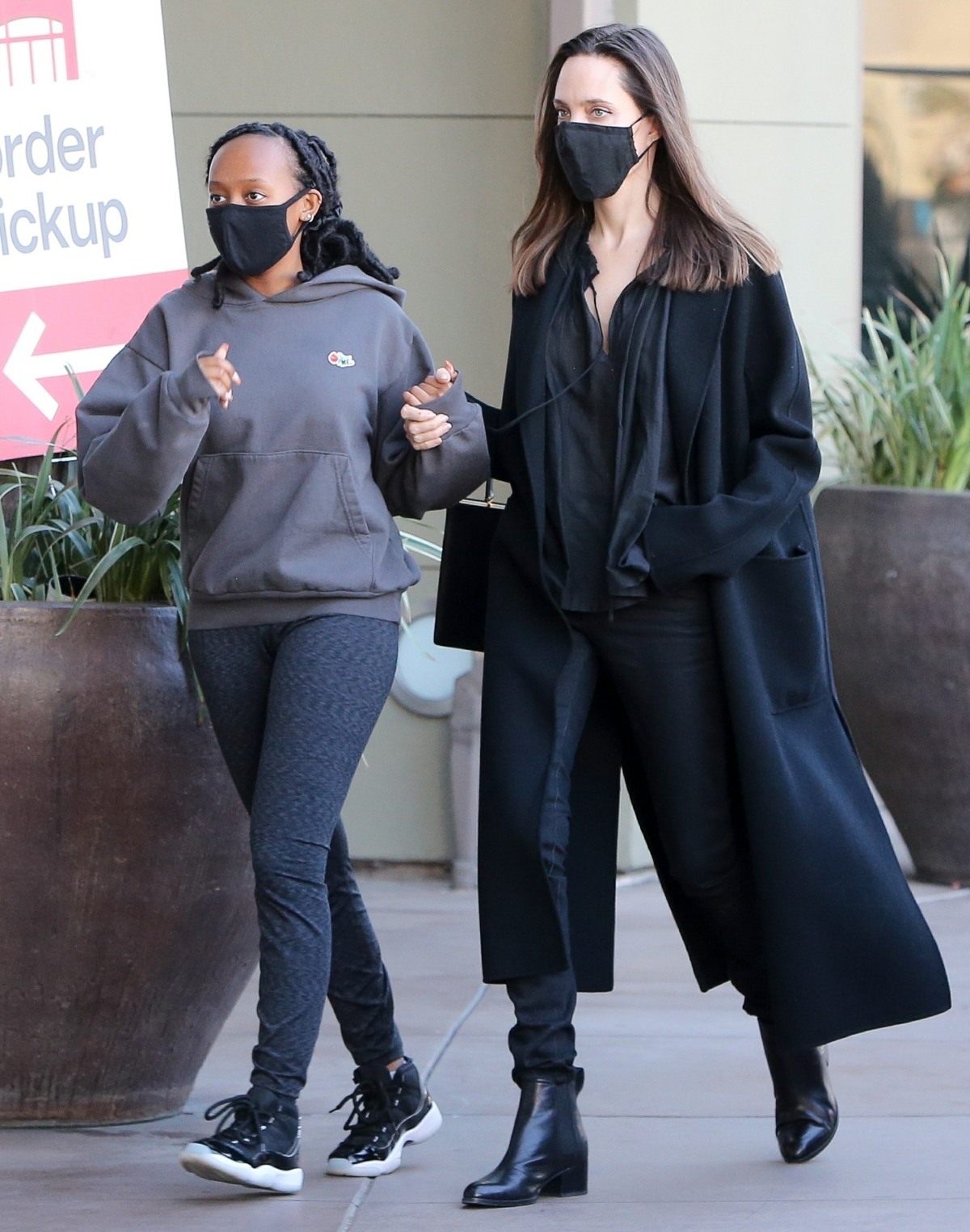 Angelina Jolie holds hands with her daughter Zahara while out shopping