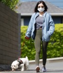 Lucy Hales wears a mask while out on a walk with Elvis