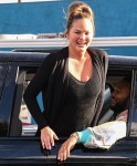 John Legend and Chrissy Teigen drive through Biden's parade in West Hollywood, CA