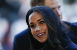 Britain's Prince Harry's fiancee US actress Meghan Markle is greeted as they arrive to attend a Terrence Higgins Trust World AIDS Day charity fair at Nottingham Contemporary in Nottingham, central England, on December 1, 2017. 
Prince Harry and Meghan Ma