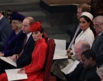 Britain's Kate, Duchess of Cambridge, foreground centre, sits with Prince Willia