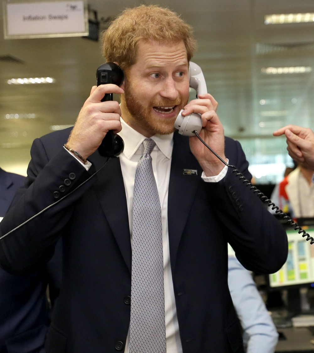 Britain's Prince Harry, the Duke of Sussex completes a trade as he attends the 15th annual BGC Charity Day, in London, Wednesday, Sept. 11, 2019. The day is held each year by BGC Partners to commemorate the 658 Cantor Fitzgerald and the 61 EuroBrokers emp