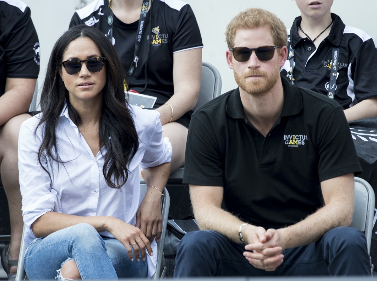 Prince Harry and his girlfriend Meghan Markle watch a wheelchair tennis match as part of the Invictus Games in Toronto
