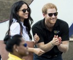 Prince Harry and his girlfriend Meghan Markle watch a wheelchair tennis match as part of the Invictus Games in Toronto