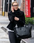 A make-up free Kate Winslet makes a call as she goes out for a walk wearing a tailored jacket, leggings and low-cut cowboy boots on a rainy day in Manhattan's TribeCa Neighborhood