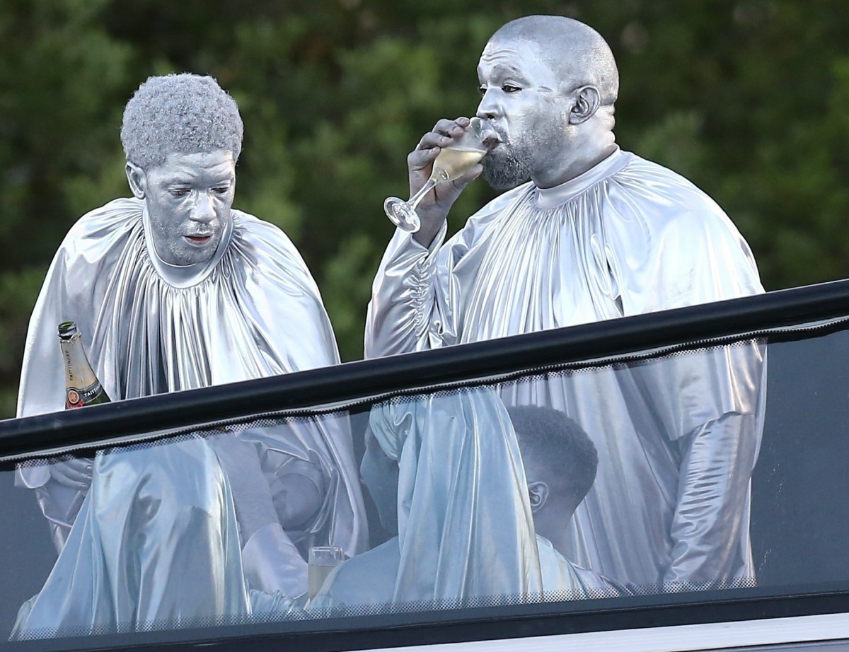 Kanye West attends a church event in Miami covered in silver