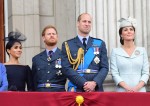 From left, Queen Elizabeth II, Meghan Duchess of Sussex, Prince Harry Duke of Sussex, Prince William Duke of Cambridge and Katherine Duchess of Cambridge watch the RAF 100th anniversary flypast from the balcony of Buckingham Palace, London, Tuesday 10th J