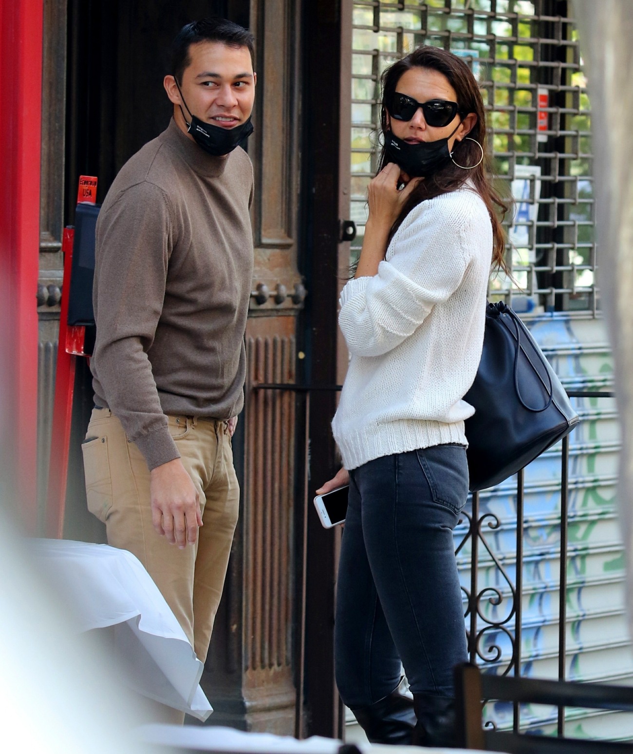 Katie Holmes and Emilio Vitolo are all smiles as they continue another steamy make-out session outside his restaurant in NYC