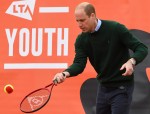 Britain's Prince William, Duke of Cambridge,, plays tennis games with local scho