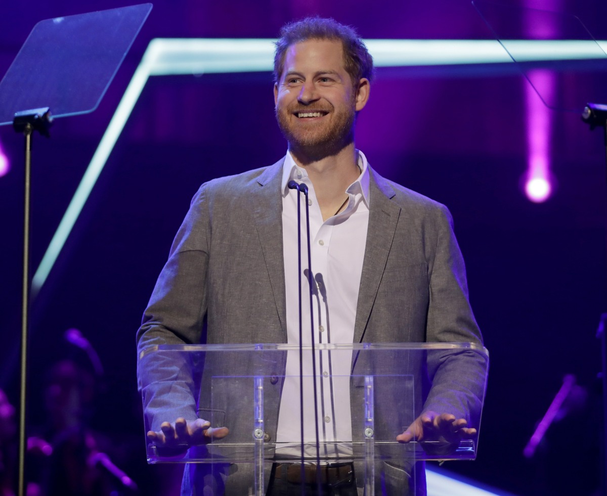 Britain's Prince Harry gives a speech on stage before announcing the winners of the Health and Wellbeing category at the inaugural OnSide Awards at the Royal Albert Hall in London, Sunday, Nov. 17, 2019. OnSide is a charity whose purpose is to create stat