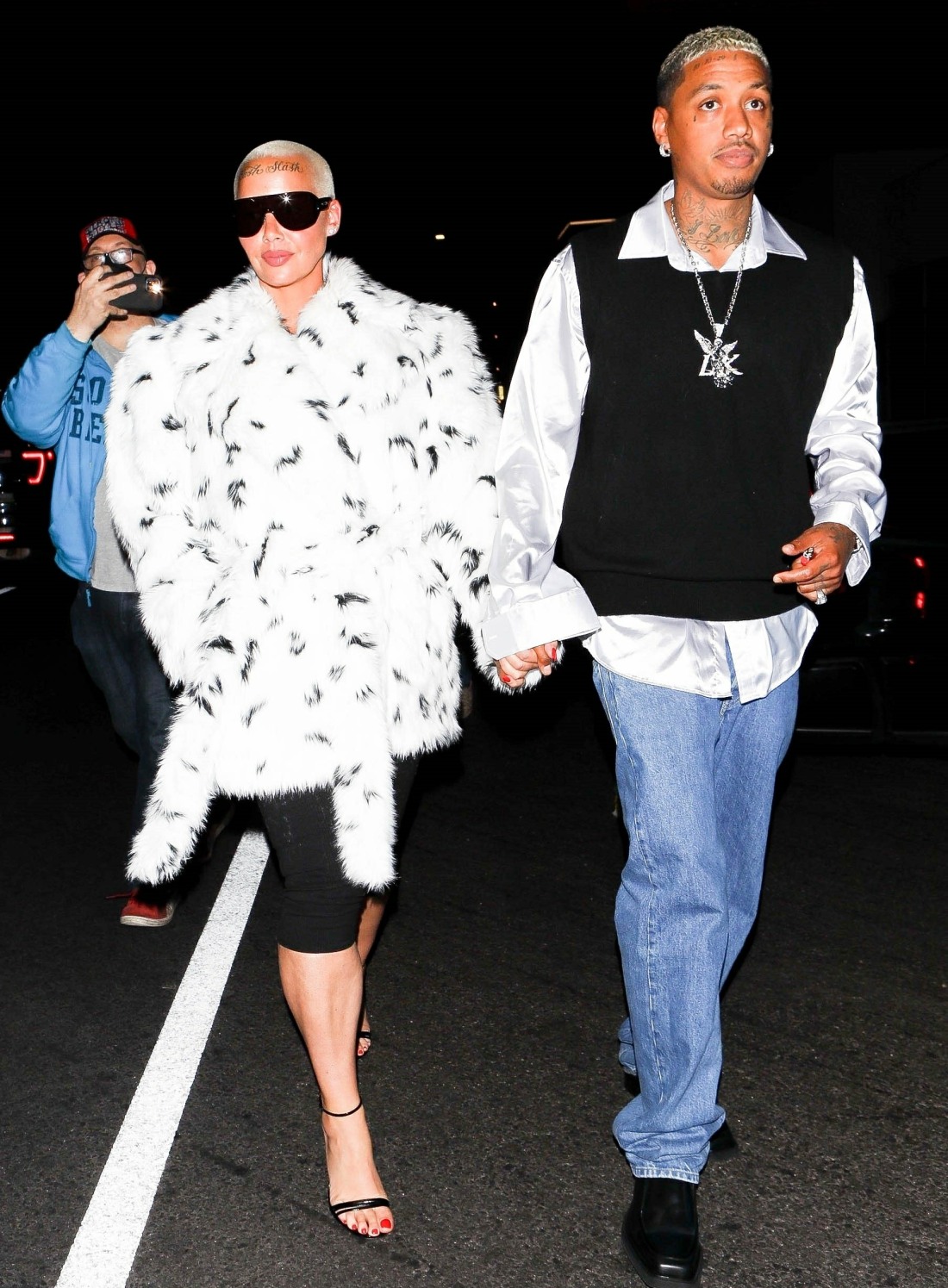 Amber Rose holds hands with her boyfriend Alexander Edwards while leaving a party at The Nice Guy!