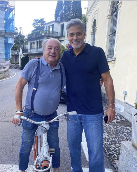 George Clooney walking the streets of Laglio, near his Italian home on Lake Como, to give his support to the owners of bars and restaurants who have been affected by severe weather.