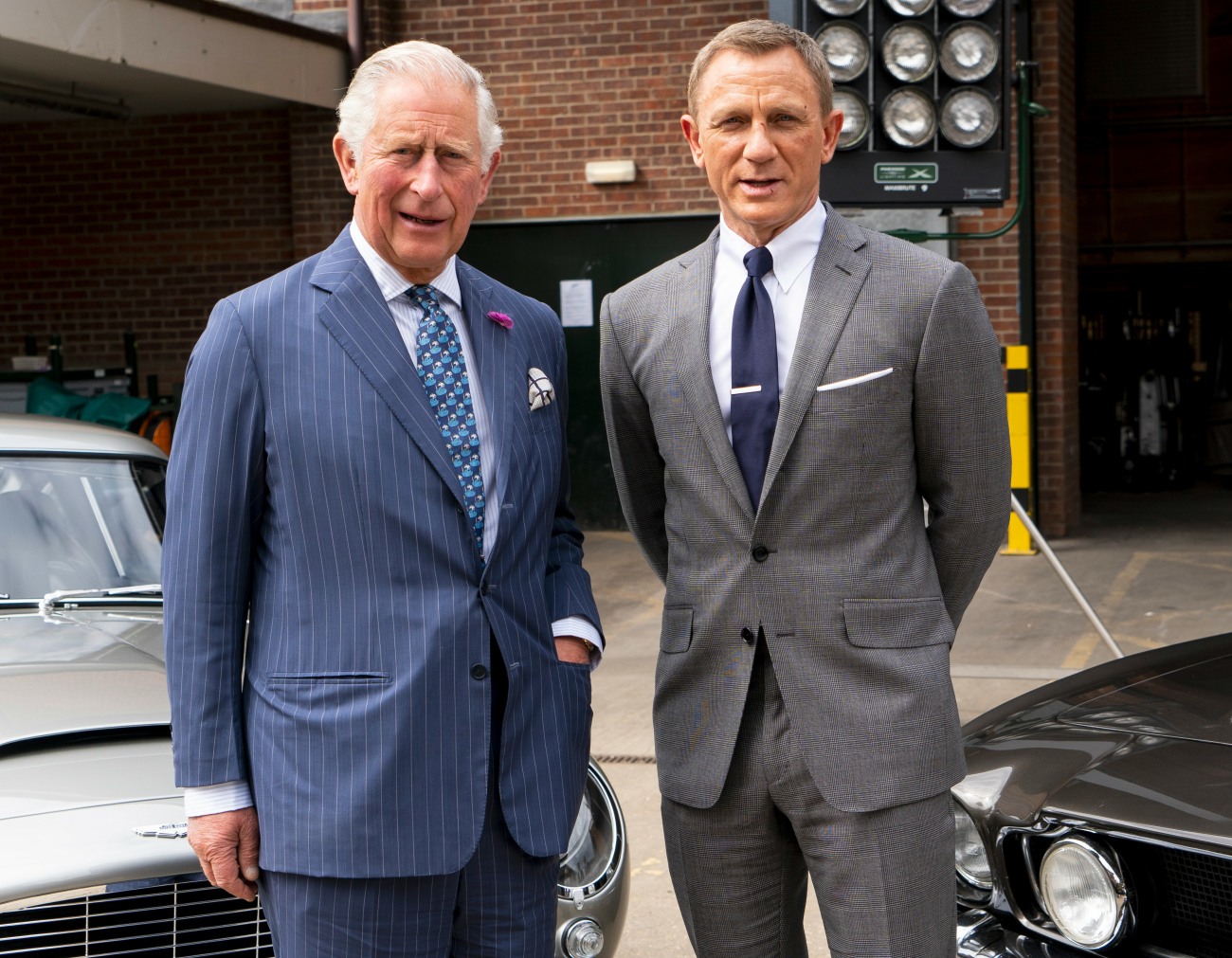Britain's Prince Charles, Prince of Wales poses with British actor Daniel Craig as he tours the set of the 25th James Bond Film at Pinewood Studios in Iver Heath, west of London, on June 20, 2019. - The Prince of Wales, Patron, The British Film Institute