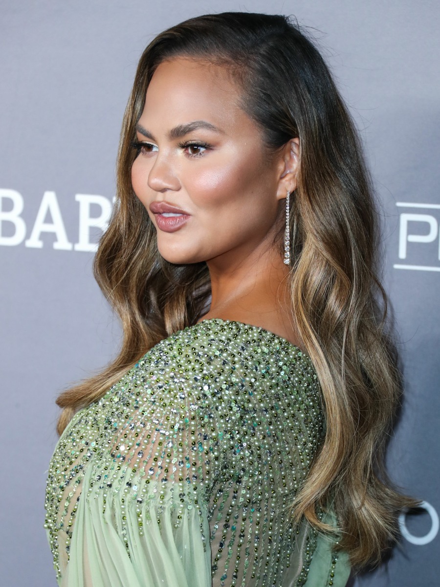Model Chrissy Teigen wearing a Georges Hobeika dress arrives at the 2019 Baby2Baby Gala held at 3Labs on November 9, 2019 in Culver City, Los Angeles, California, United States.