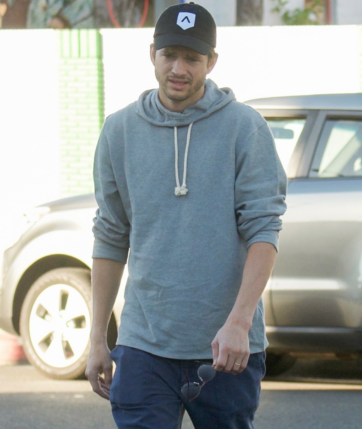 Ashton Kutcher runs errands in Los Angeles keeping it casual in a hoodie and cap