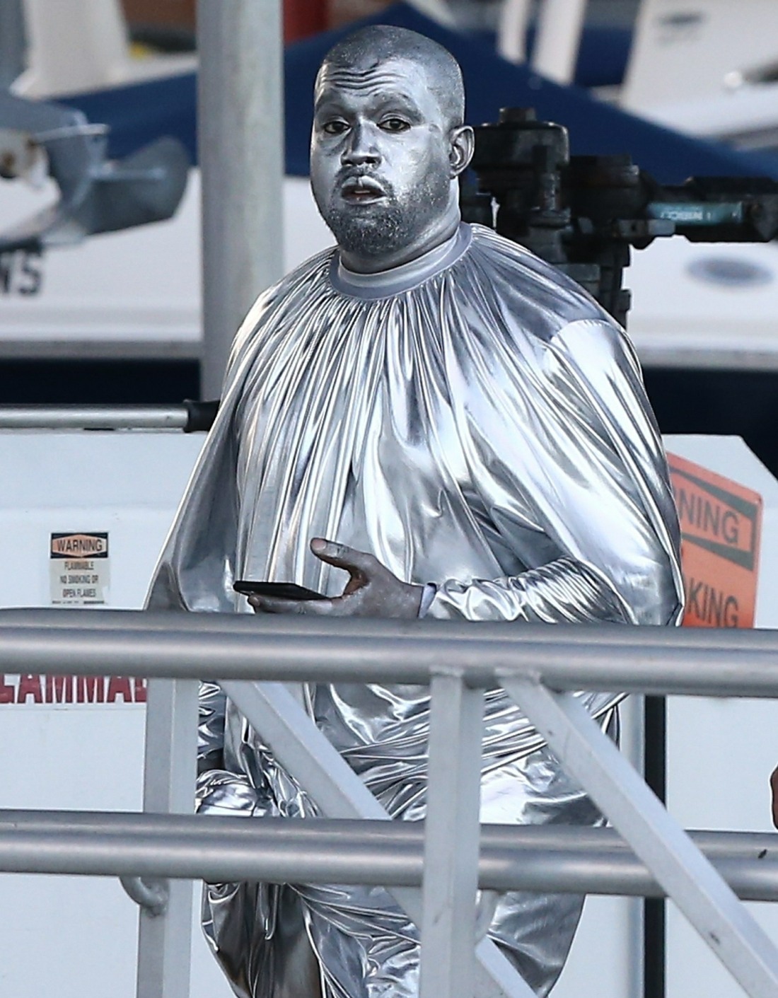 Kanye West attends a church event in Miami covered in silver