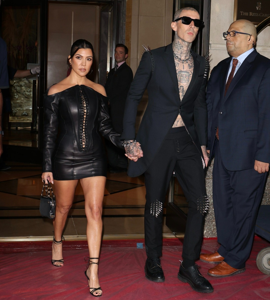 Kourtney Kardashian and Travis Barker stun as they leave their hotel for the VMAs