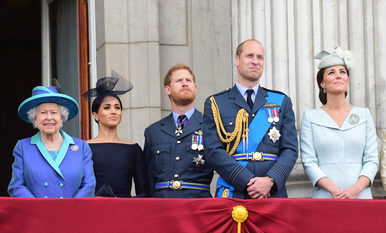 From left, Queen Elizabeth II, Meghan Duchess of Sussex, Prince Harry Duke of Sussex, Prince William Duke of Cambridge and Katherine Duchess of Cambridge watch the RAF 100th anniversary flypast from the balcony of Buckingham Palace, London, Tuesday 10th J