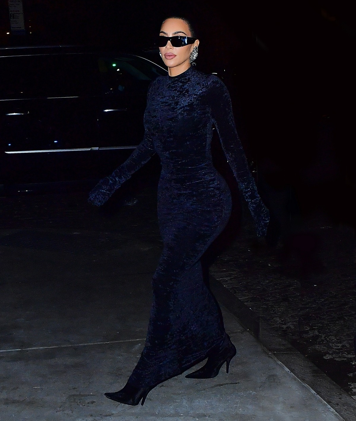 Kim Kardashian steps out in curve-hugging velvet dress as she heads out for dinner at Zero Bond in NYC