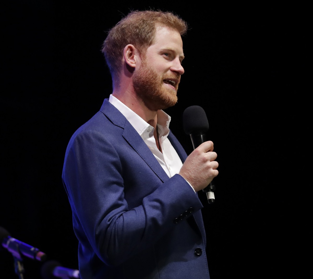 Britain's Prince Harry speaks on stage during a concert hosted by his charity Sentebale at Hampton Court Palace, in London, Tuesday June 11, 2019. The concert will raise funds and awareness for Sentebale, the charity founded by Prince Harry and Lesotho's