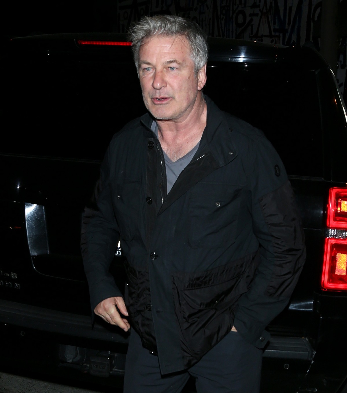 Alec and Hilaria Baldwin chat with owner Craig Susser as they leave Craig's restaurant in West Hollywood