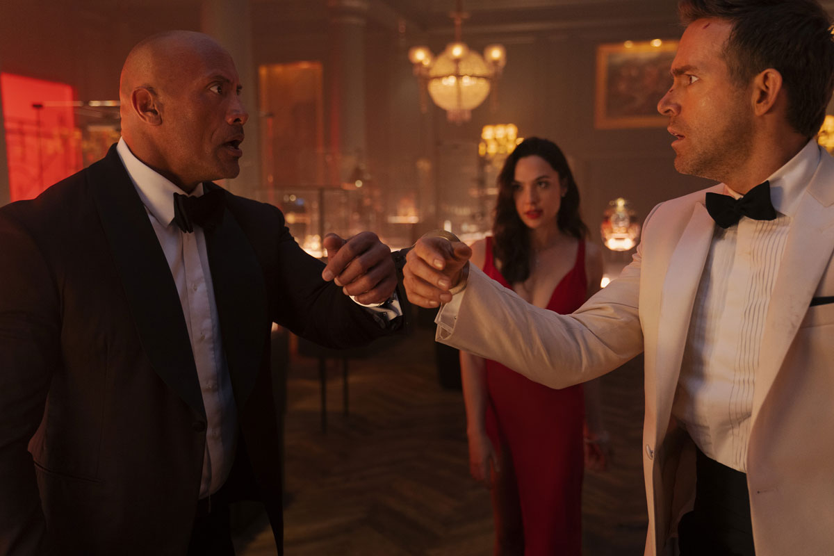 Production still from Red Notice with Ryan Reynolds, The Rock and Gal Gadot