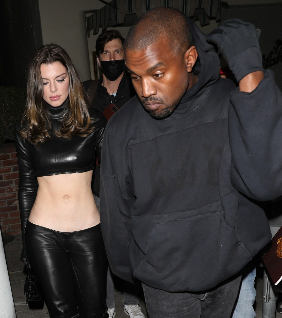 The man accusing Kanye West of assault is seen following behind him as the singer left Delilah with Julia Fox