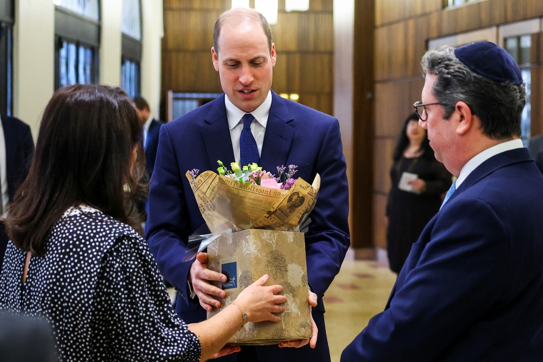 Prince William received flowers to take home to Kate while visiting the synagogue