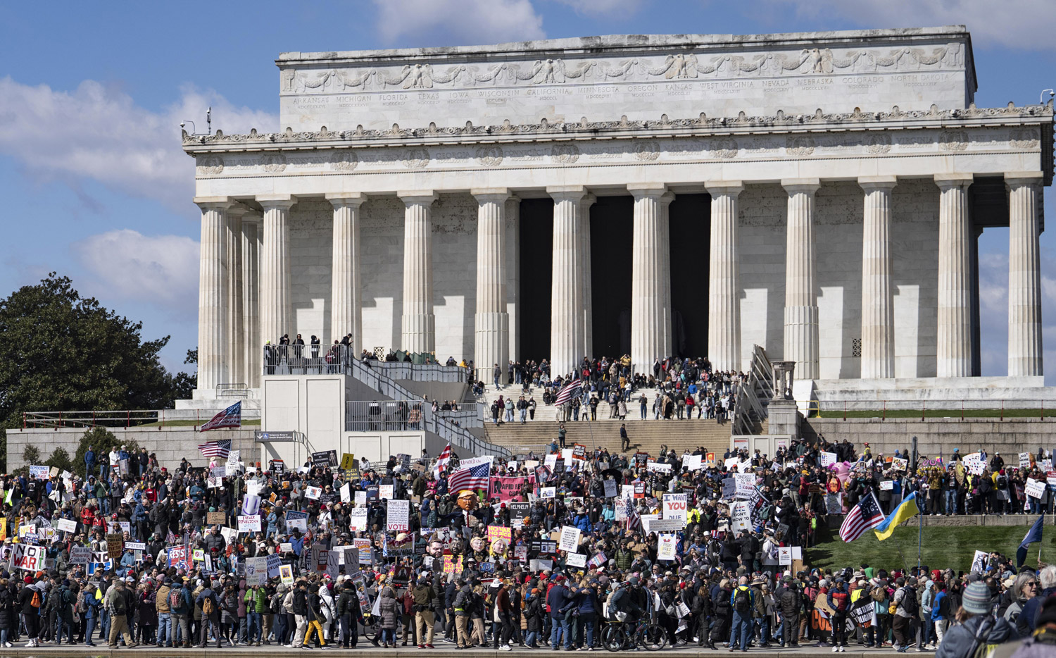 No Kings protestors assemble on the circle outside Arlington Memorial Bridge in preparation of their walk across the bridge to the Lincoln Memorial, where President Trump has targeted the circle as the site of his 250 foot arch