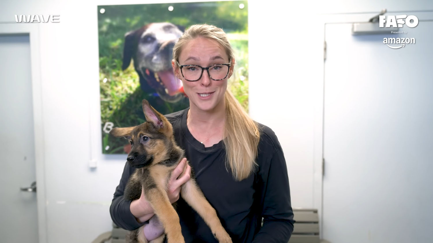 Kylie Kelce holding a German Shepherd puppy