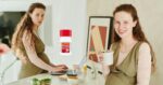 Two photos of a pregnant woman. In one she's on a computer at a counter looking concerned. In another she's smiling hoding a mug. There is a tylenol bottle pasted in the middle.