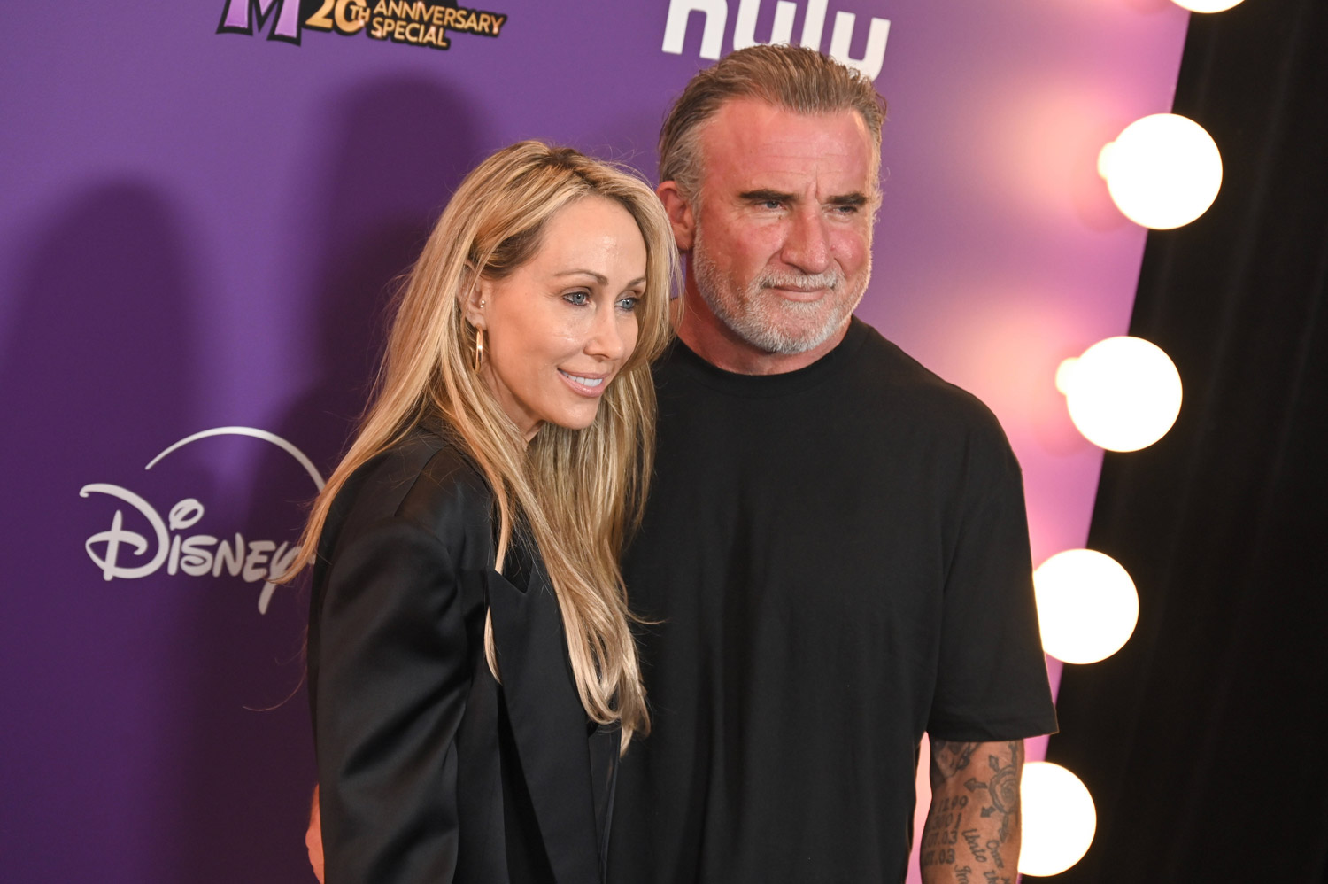 Tish Cyrus and Dominic Purcell at the World Premiere of Disney s Hannah Montana 20th Anniversary Special at El Capitan Theatre in Los Angeles. March 23, 2026