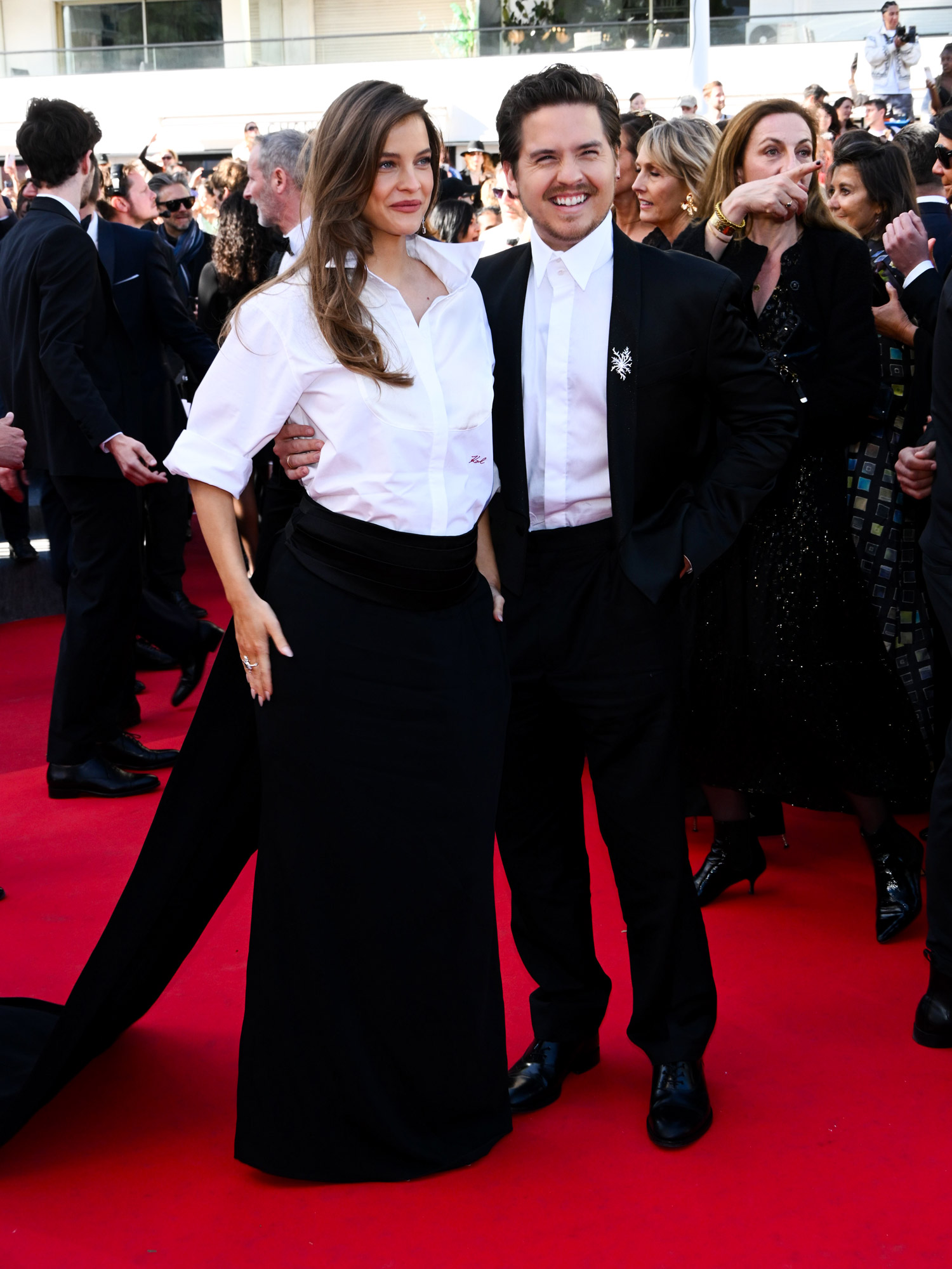 Barbara Palvin and Dylan Sprouse in black and white outfits