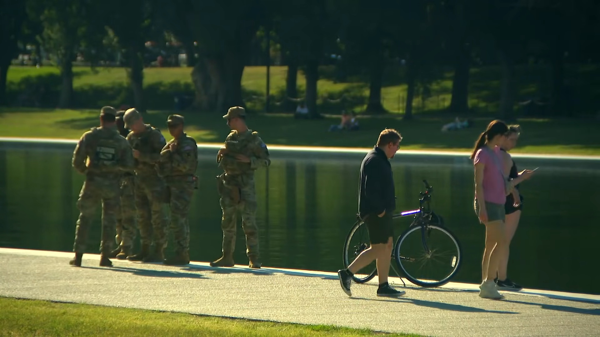 View of National Guard standing next to the Reflecting Pool, via WUSA9 on YouTube, video below