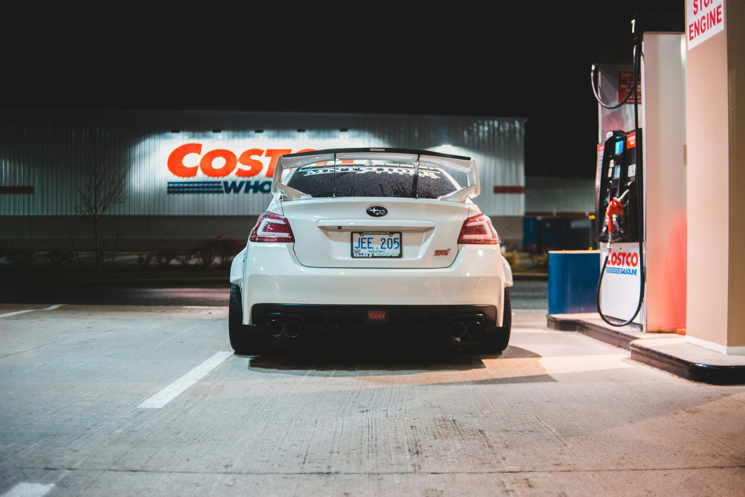 View of car at Costco gas station at night