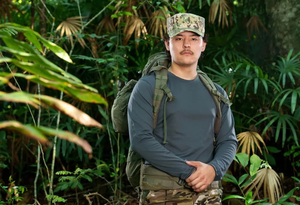 Promotional Image of Colin Gosselin in camo pants, a hat and long sleeve shirt from 'Special Forces'