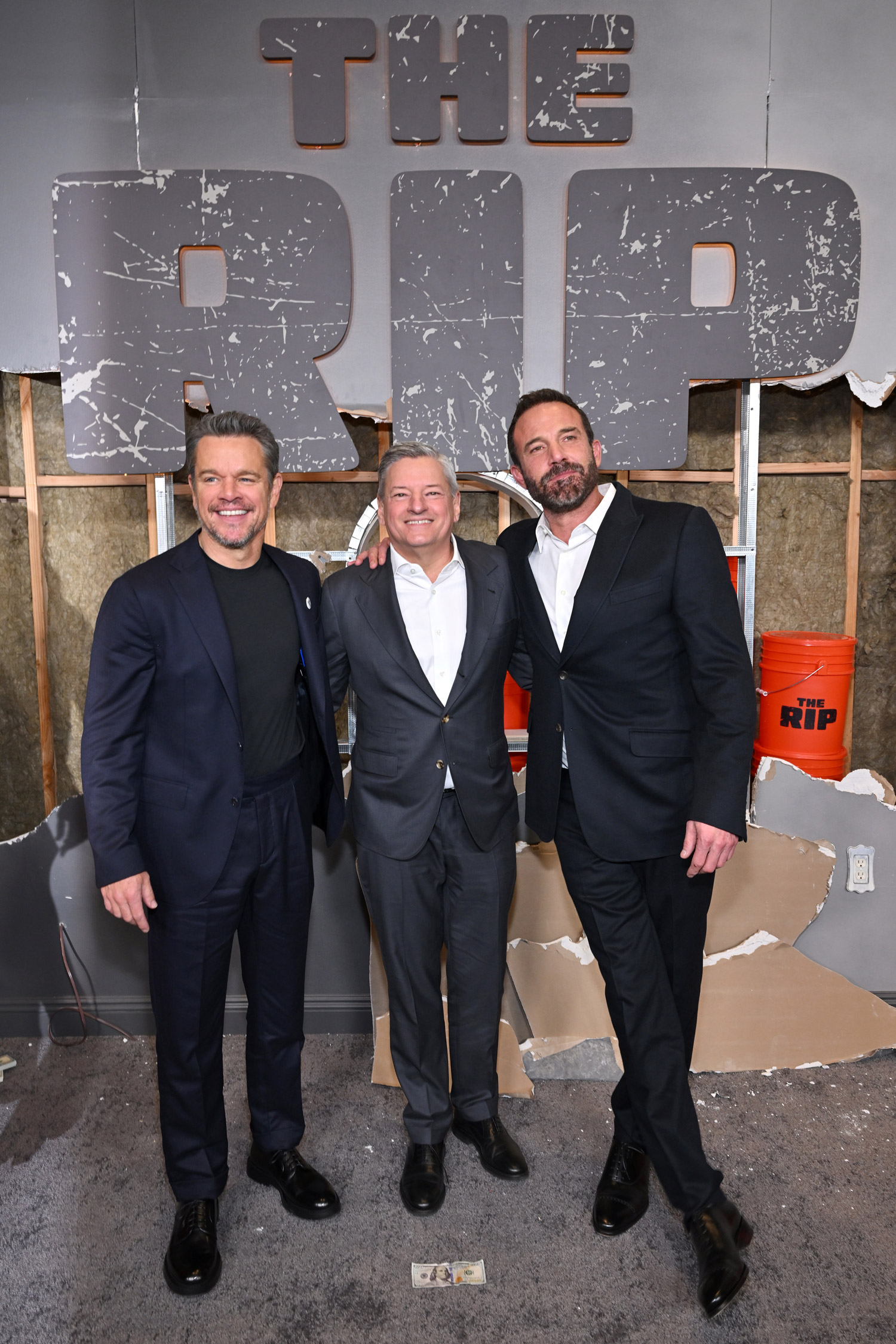 Matt Damon, Ben Affleck and Ted Sarandos at the premiere of The Rip