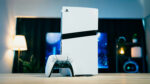 Playstation console and controller on table in front of television