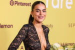 Sarah Jane Nader arrives at the 3rd Annual Rare Impact Fund Benefit 2025. She is wearing a low cut v-neck lace top and her hair is pulled back