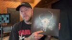 Image of album unboxing from Demon Hunter's YouTube