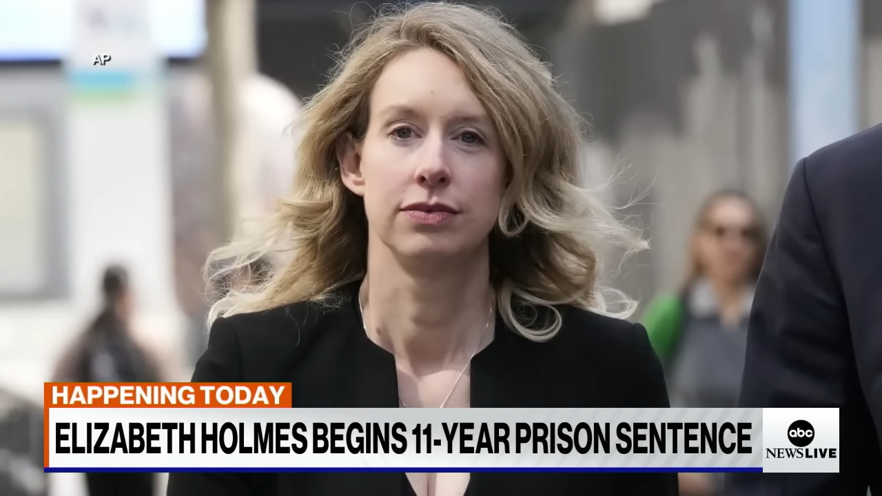 screenshot of Elizabeth Holmes on the news outside court
