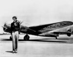 Earhart standing in front of the Lockheed Electra in which she disappeared in July 1937