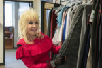 Dolly looking through her closet